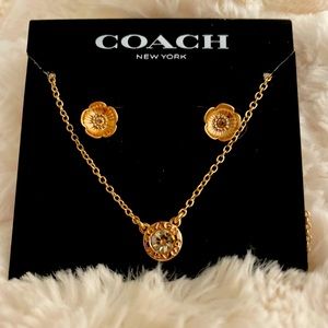 Gold Coach necklace with diamonds
